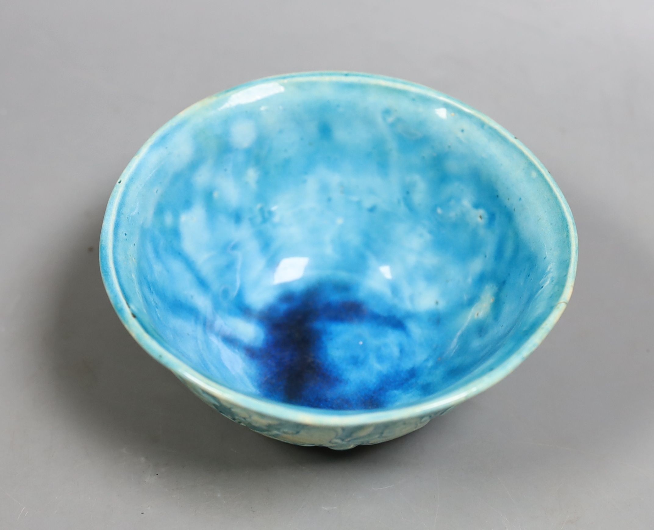 A Persian turquoise glazed fritware bowl, 12.5 cms diameter.